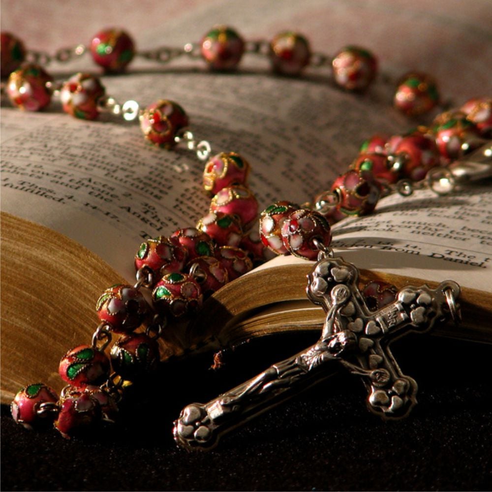 Rosary over Bible